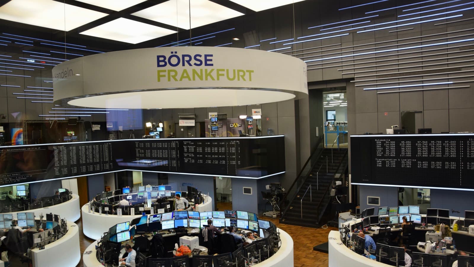 A wide view of the Frankfurt Stock Exchange trading floor and market screens
