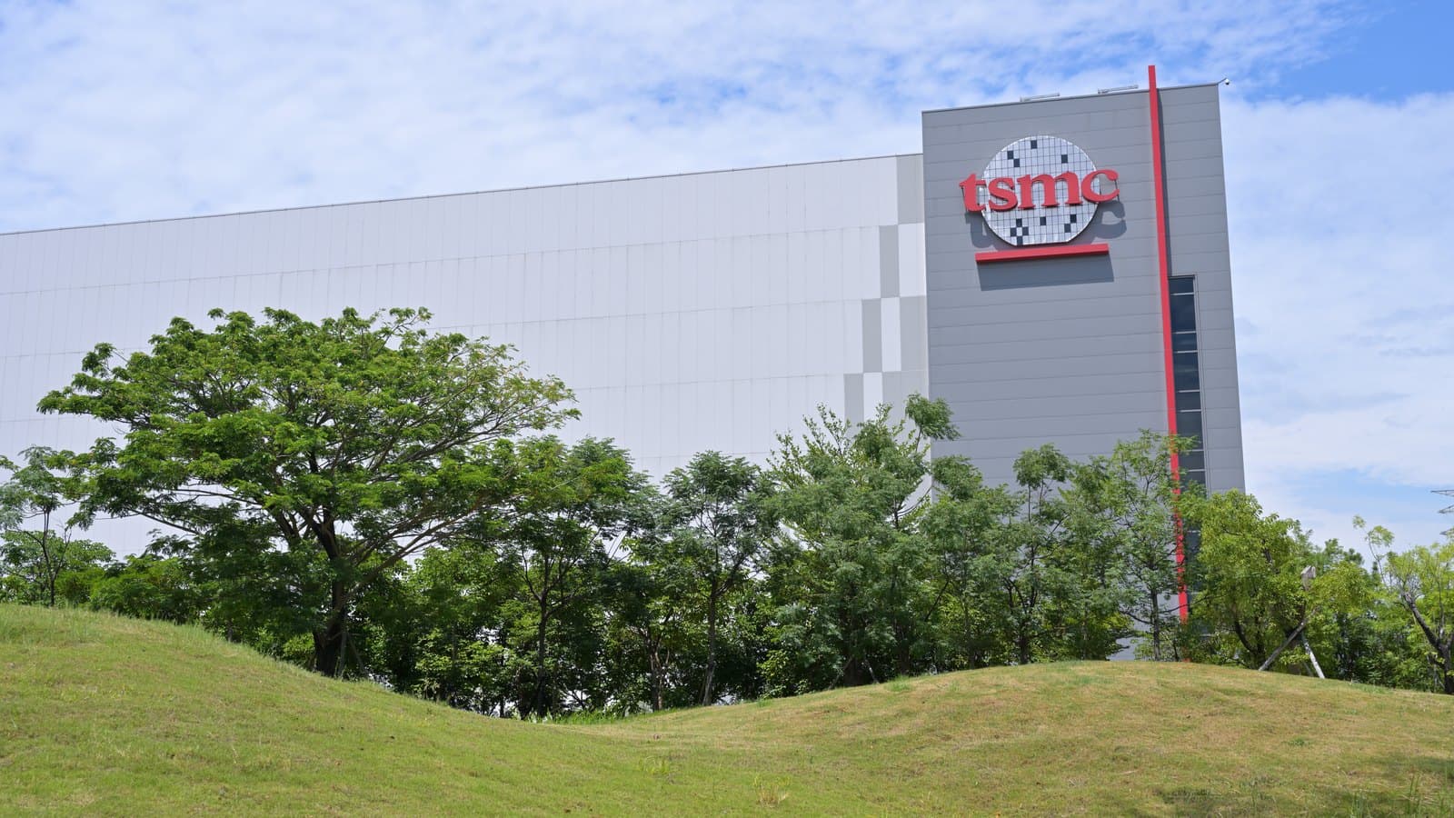 TSMC’s Advanced Packaging Plant 2 building in Taiwan under a blue sky.