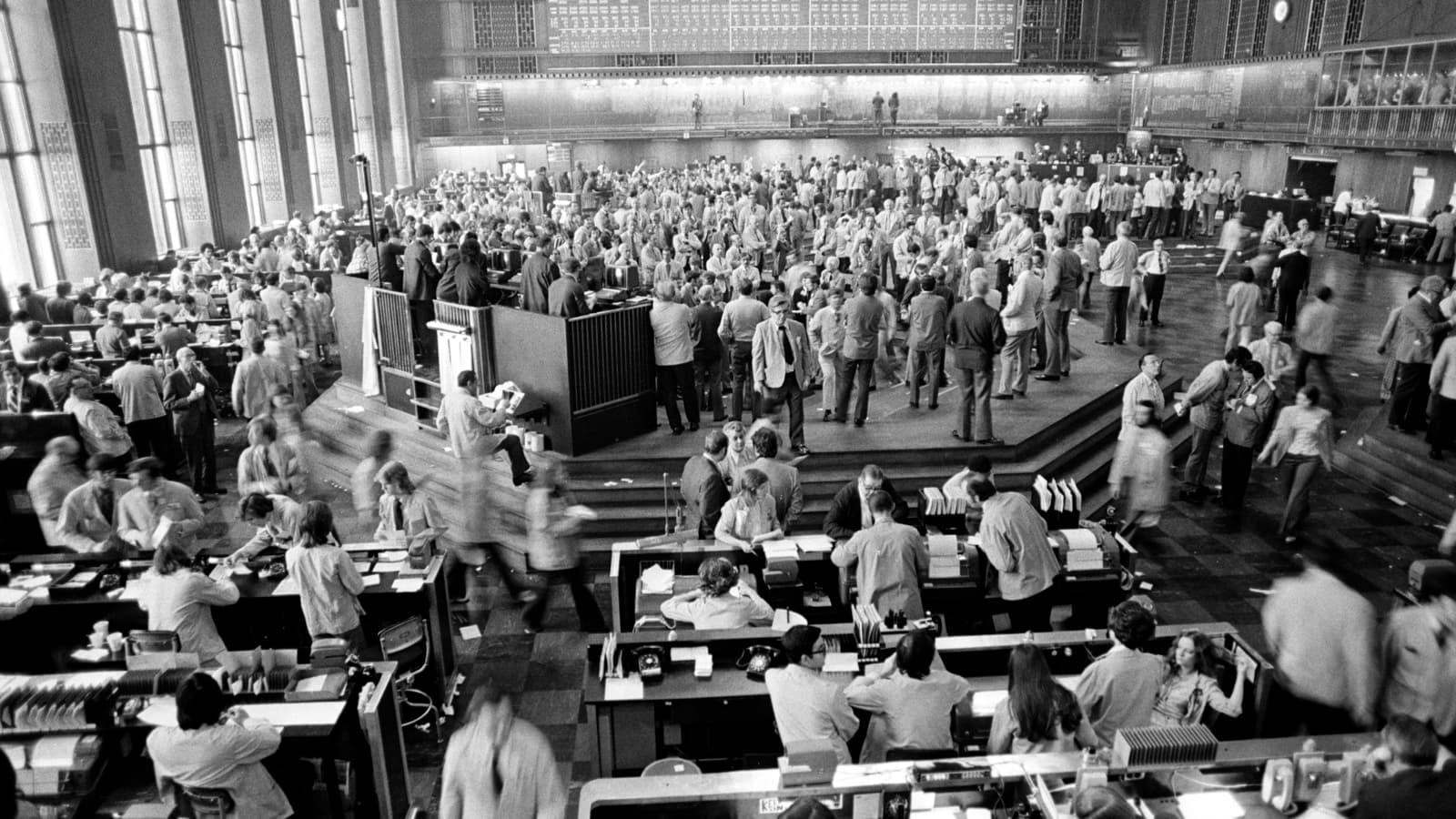 Archival black-and-white photograph of traders working on the Chicago Board of Trade floor in 1973.