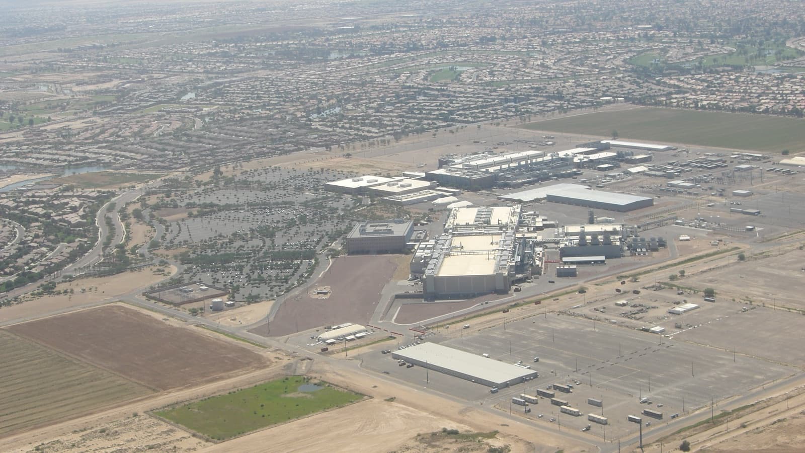Intel semiconductor fabrication buildings in Arizona under a clear blue sky