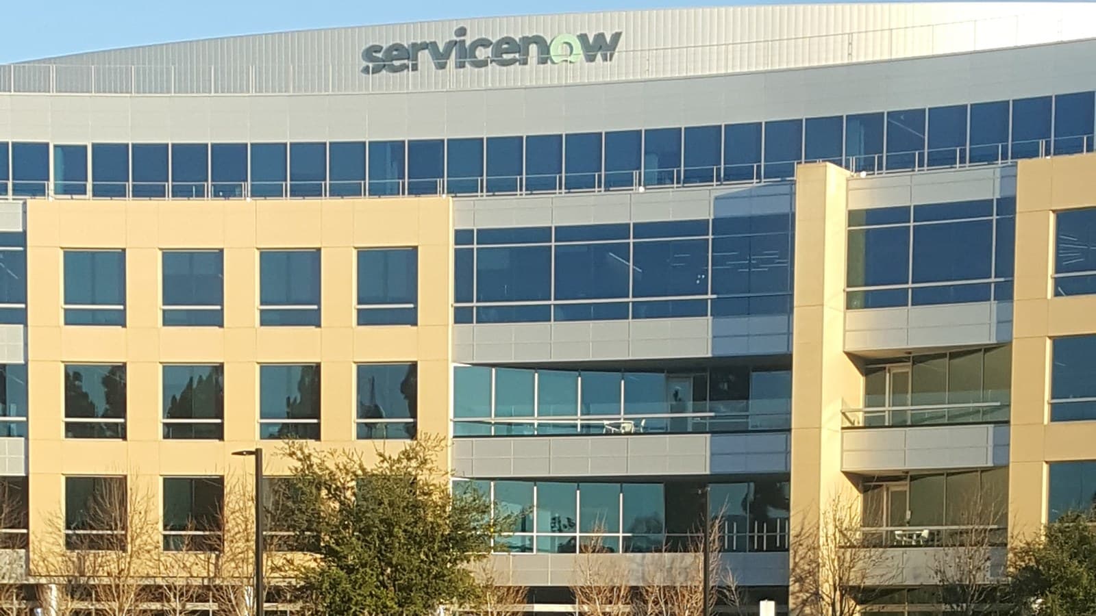 ServiceNow global headquarters office building with the company name above its windows