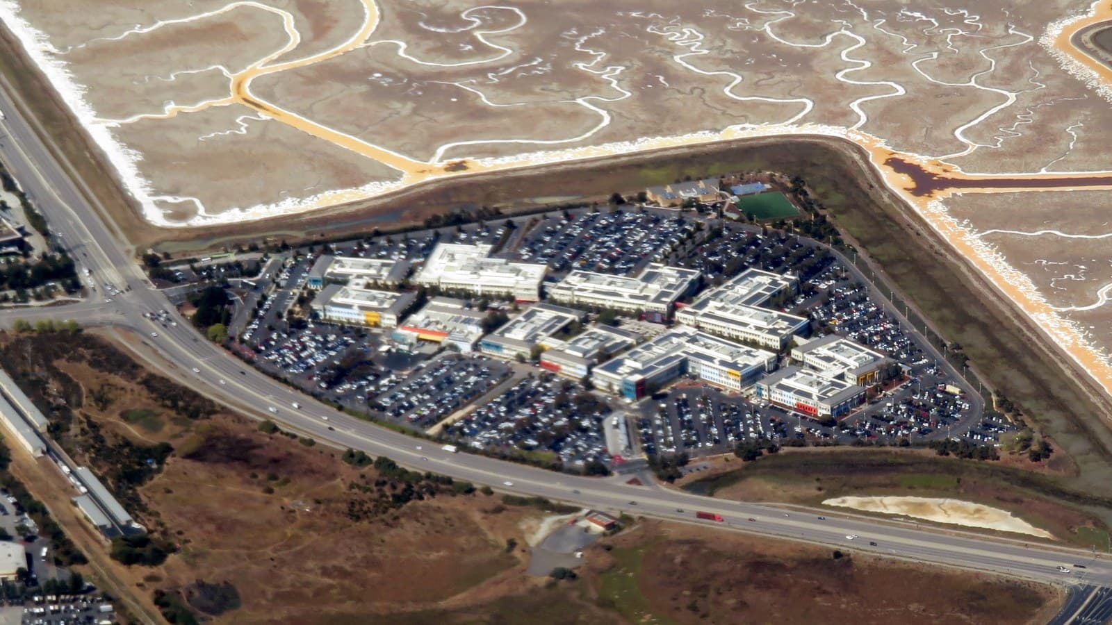 Aerial photograph of Meta’s former Facebook campus in Menlo Park beside the San Francisco Bay wetlands