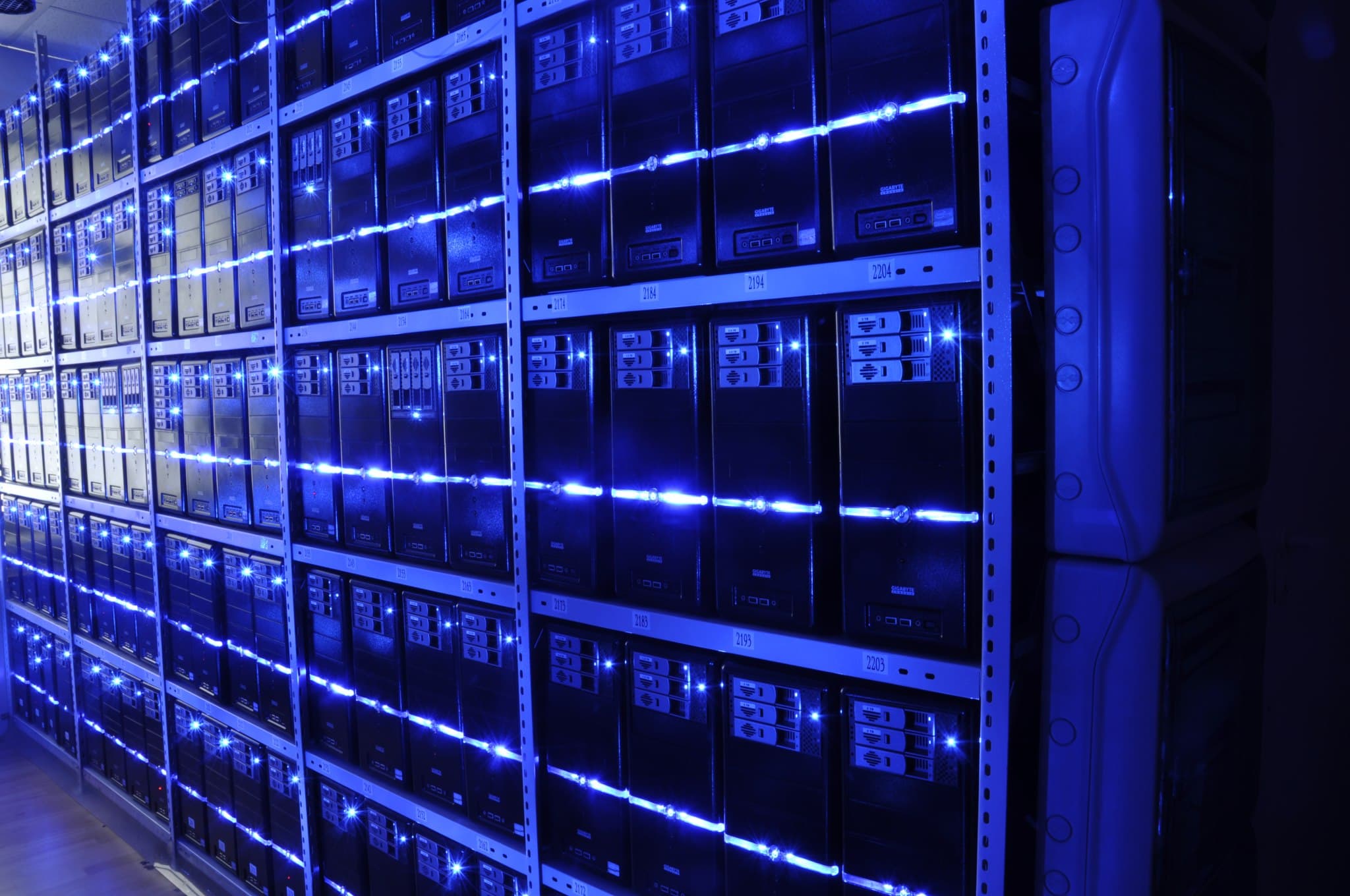 Blue-lit server racks inside a data centre, illustrating the infrastructure used by data-intensive enterprise software