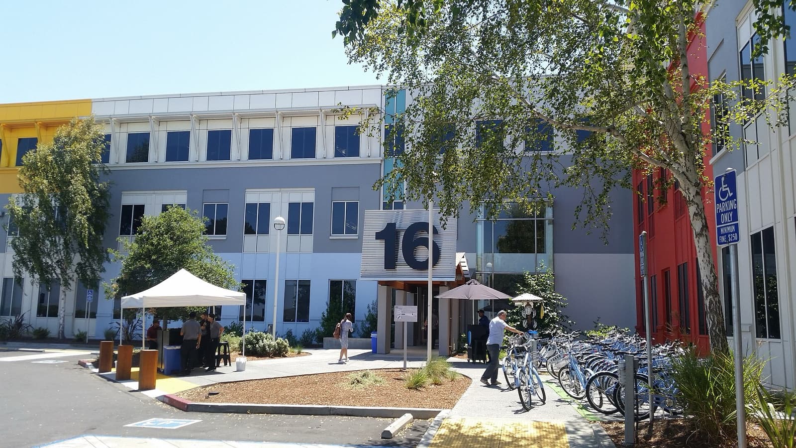 Daylight photograph of a Facebook headquarters building and courtyard in Menlo Park