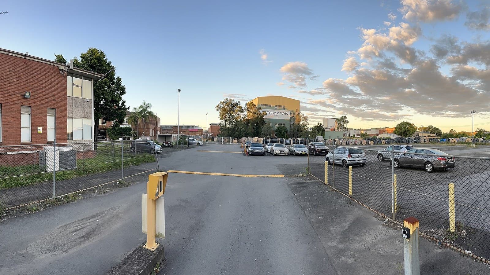 Prysmian cable premises in Moorebank, Australia, with the company sign and rows of cable drums