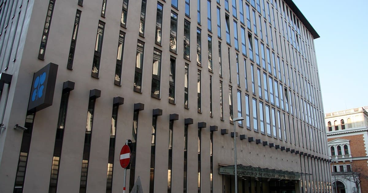 OPEC headquarters in Vienna with the blue OPEC emblem and main entrance visible.