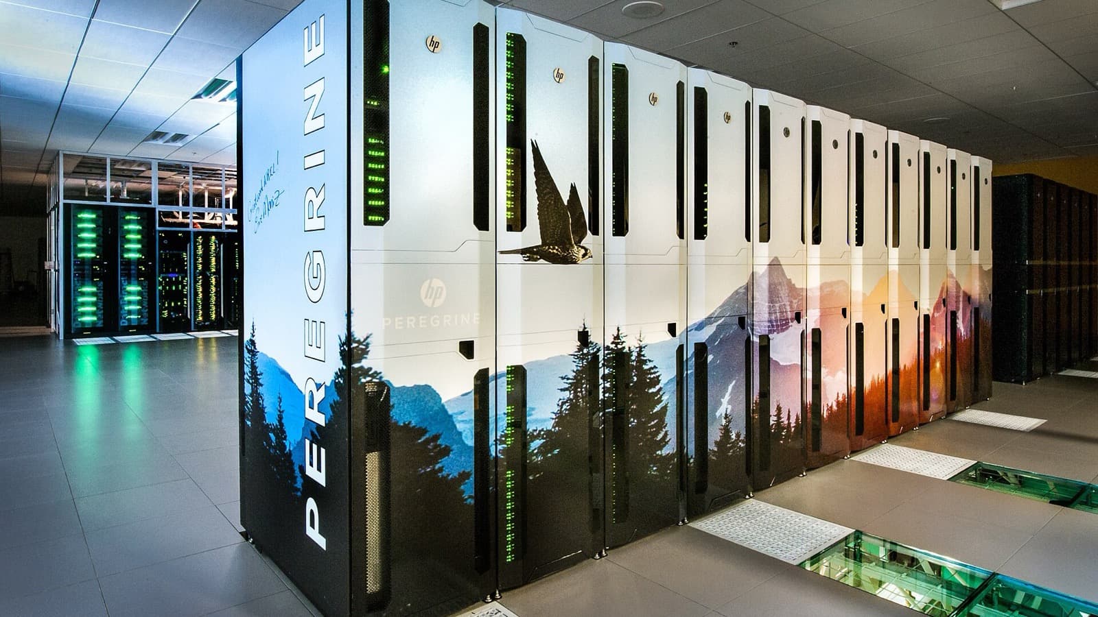 White Peregrine supercomputer cabinets and illuminated server racks in a data center