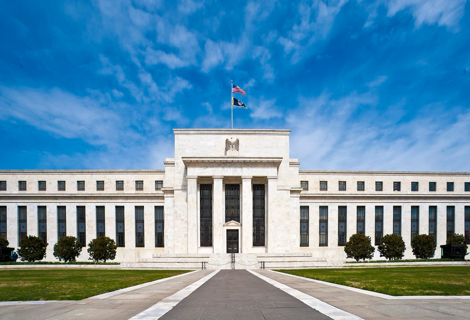 The Federal Reserve's Eccles Building in Washington, D.C., under a blue sky