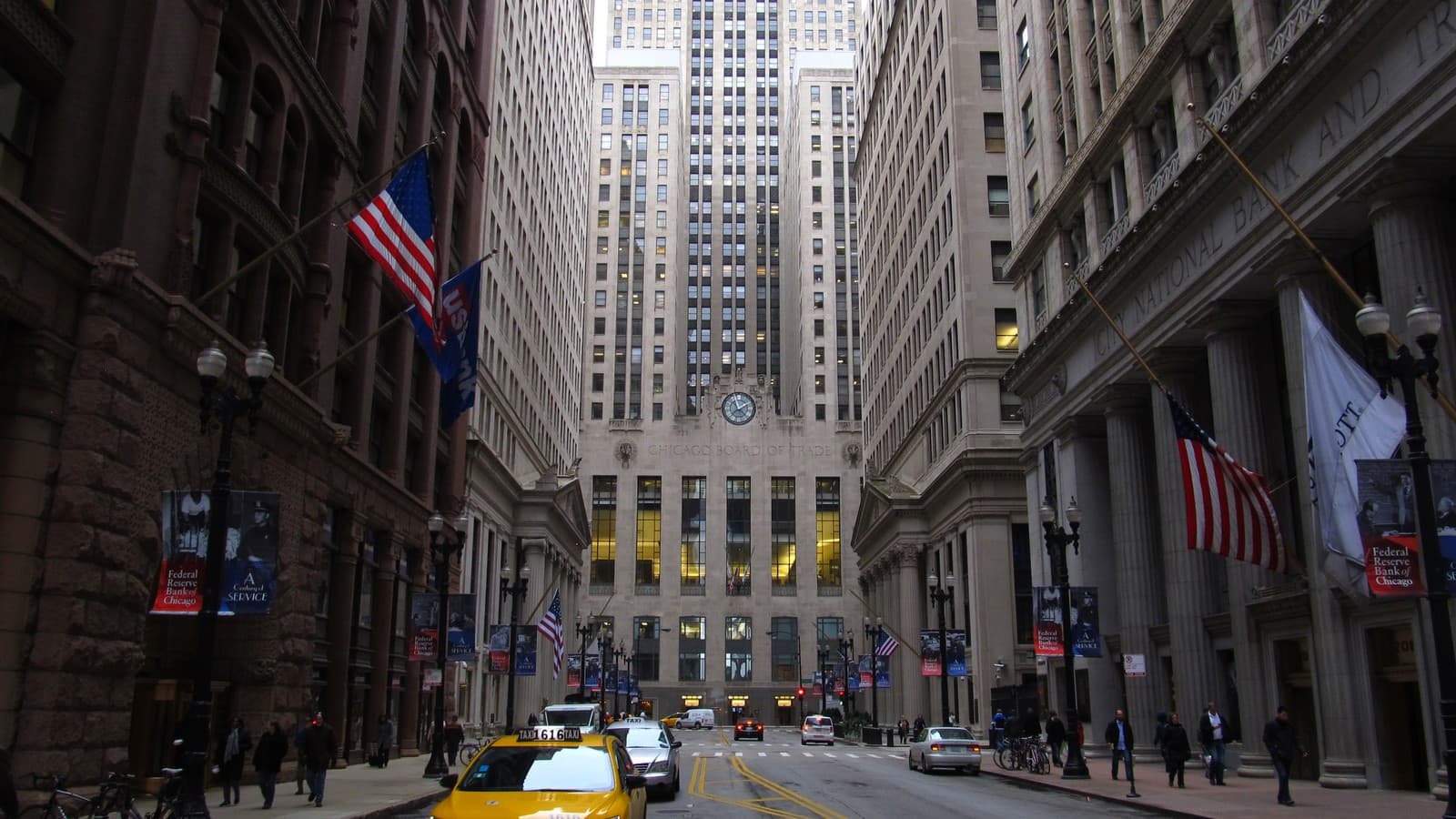 Archival view down LaSalle Street toward the Chicago Board of Trade building, with taxis and pedestrians.