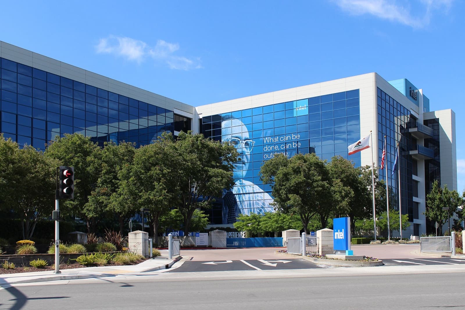 Intel's headquarters building at 2200 Mission College Boulevard in Santa Clara, California, under a blue sky