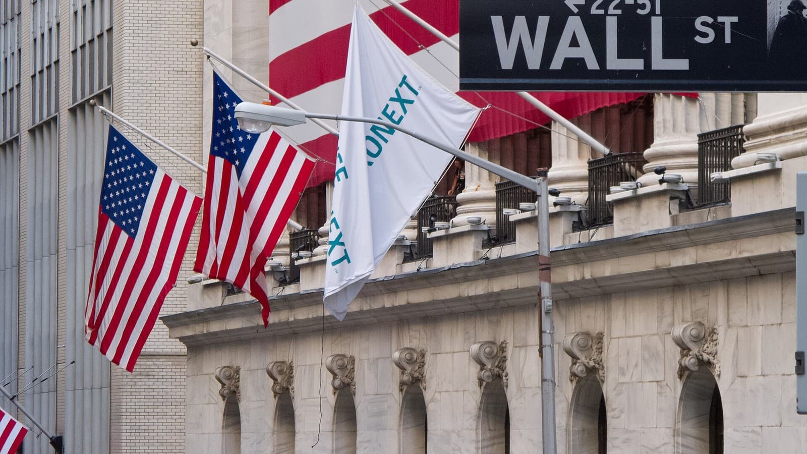American and exchange flags outside the New York Stock Exchange on Wall Street